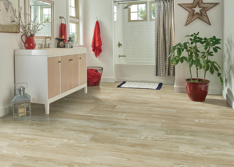Bathroom with a shower and vanity using LVT for waterproof protection