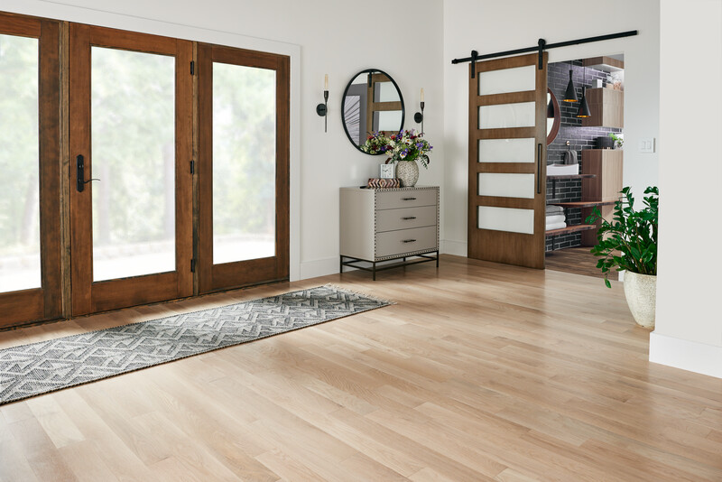 Room with patio door featuring solid oak hardwood floors